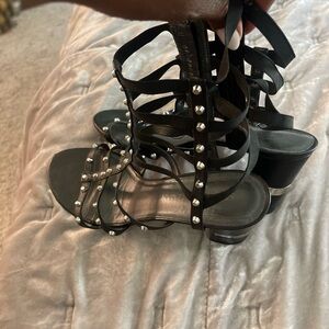 Stuart Weitzman black leather gladiator heel with silver studs. Size 10